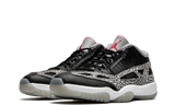 919712-006-nike-air-jordan-11-low-ie-black-cement-sneakers-heat-2